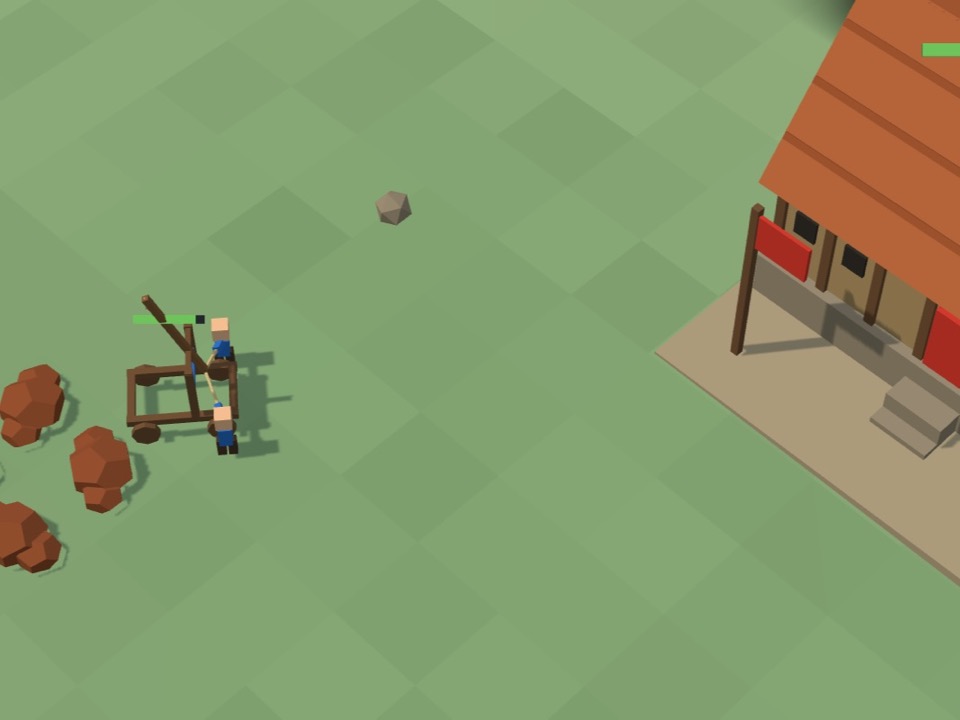 A stone thrower on the grass with two crew members, and a stone flying through the air toward a hall with red roof tiles on the right.
